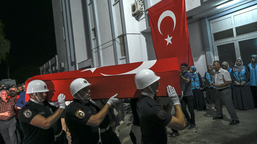 Coffin of US-Turkish activist Aysenur Ezgi Eygi, who was shot dead in the West Bank, is carried by Turkish honor guard police officers to a morgue at the Didim district in Aydin on Sept. 13, 2024. 