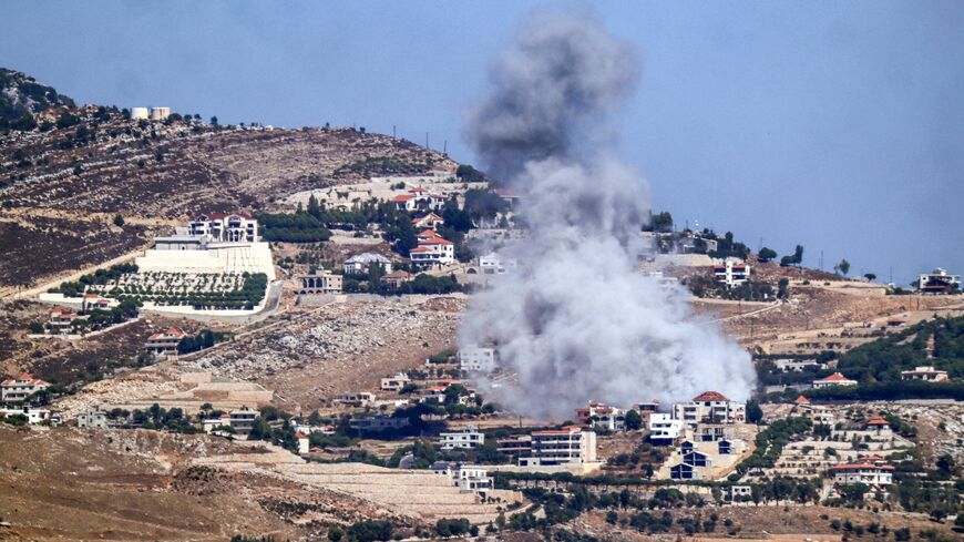 A cloud of smoke erupts during an Israeli airstrike on the village of Sujud in southern Lebanon on Sept. 25, 2024. 