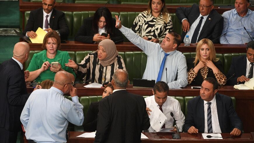 Tunisian lawmakers discuss the draft electoral reform that would strip a court from some of its powers