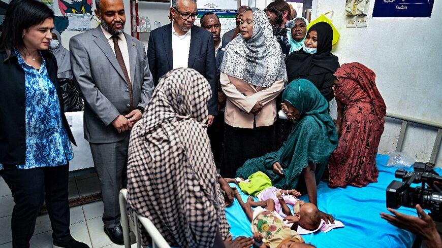 World Health Organization chief  Tedros Adhanom Ghebreyesus (C) visits a children's hospital in Port Sudan on September 7, 2024