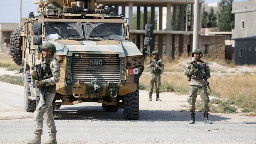 Turkish soldiers patrol the northern Syrian town of Tal Abyad on the border between Syria and Turkey on Oct. 23, 2019. 