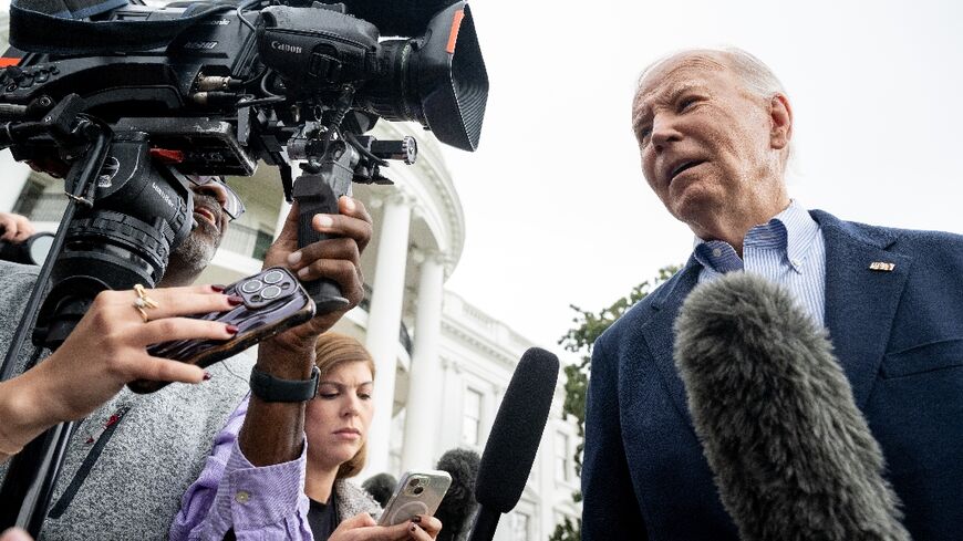 US President Joe Biden speaks to the media prior to departing on Marine One from the South Lawn of the White House in Washington, DC, on October 3, 2024, as he travels to Florida and Georgia to view damage from Hurricane Helene.