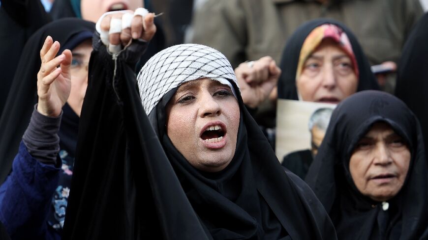 Iranians shout slogans during an anti-Israel rally in Tehran on October 8