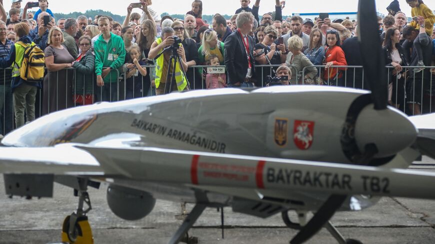 A Turkish Bayraktar TB2 combat drone is on view during a presentation at the Lithuanian Air Force Base in Siauliai, Lithuania, on July 6, 2022. 