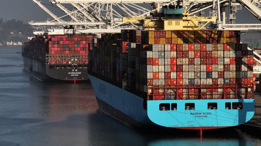 In an aerial view, container ships sit docked at the Port of Oakland on May 21, 2024, in Oakland, California. 