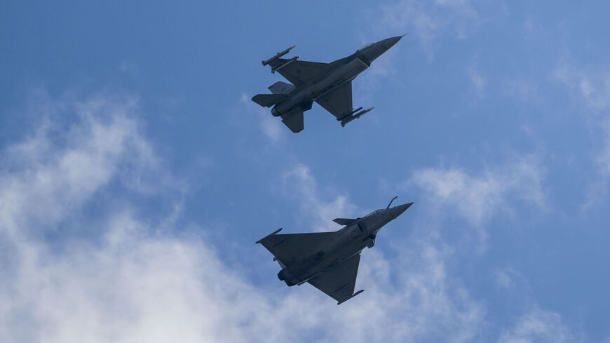 A Dassault Rafale C (below) and an F-16 Fighting Falcon combat airplane perform maneuvers over Ramstein Air Base during a day of fighter plane exercises on June 06, 2024 in Ramstein-Miesenbach, Germany. 