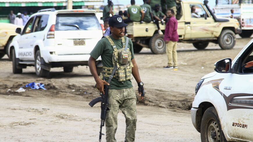 A member of a "joint security cell" made up of various military and security services affiliated with Sudan's army takes part in a parade in Gedaref in the east of the war-torn country, on July 28, 2024. 