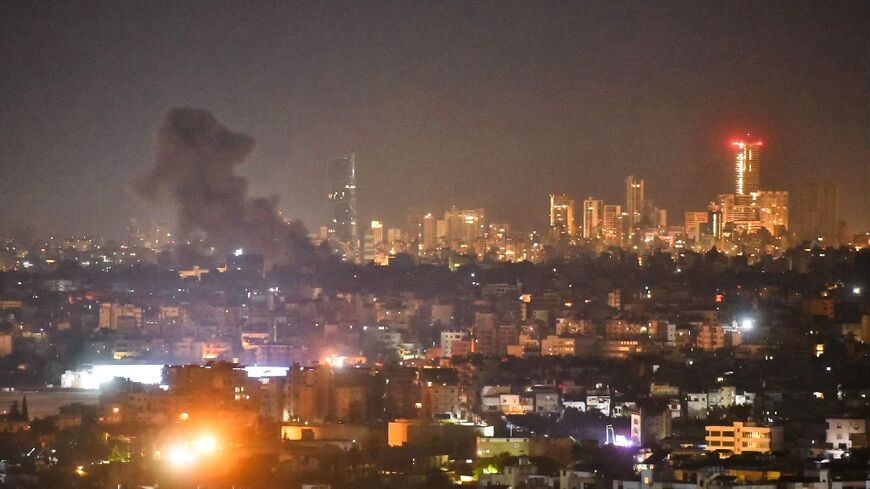 Smoke rises from areas targeted by an Israeli airstrike in Beirut’s southern suburbs