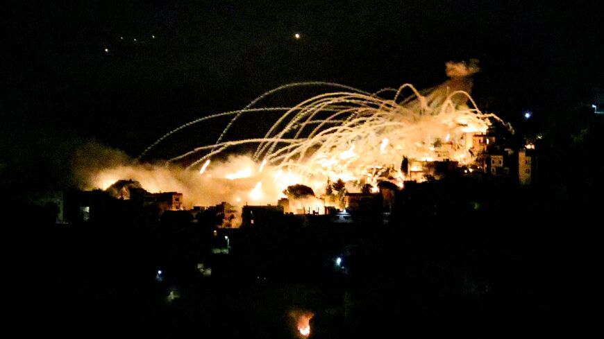 An explosion lights up the night sky over the south Lebanon town of Khiam