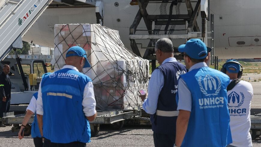 Staff unload a medical aid shipment at the Beirut International Airport