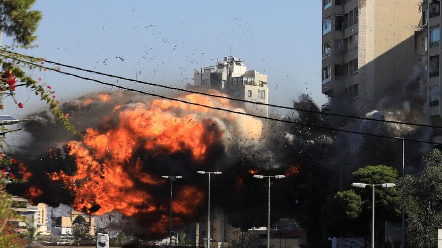 A ball of fire erupts as an Israeli strike hits a building in the Beirut southern suburb of Ghobeiri.