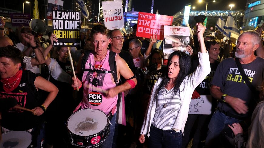 Israelis demanding the return of Gaza hostages block a road in Tel Aviv after Gallant was dismissed