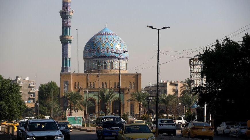 Cars drive past Baghdad's Seventeen Ramadan Mosque on November 19 ahead of Iraq's first census in nearly 40 years