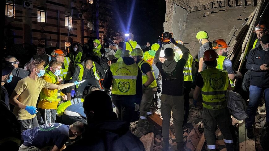 Emergency teams at the site of an Israeli strike on Beirut's Zuqaq al-Blat neighbourhood