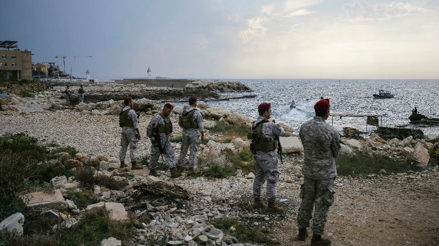 Lebanese soldiers inspect the beach where Israeli naval commandos are believed to have landed on Friday