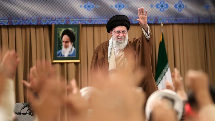 Iran's supreme leader Ayatollah Ali Khamenei greeting the crowd during a meeting with Basij paramilitaries in Tehran