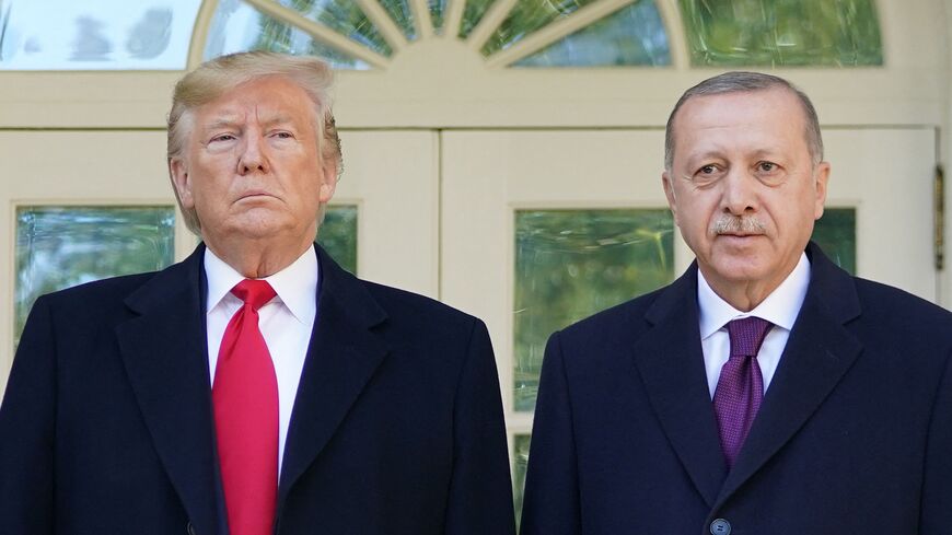 US President Donald Trump greets Turkey's President Recep Tayyip Erdogan(L) upon arrival outside the White House in Washington, on Nov. 13, 2019.