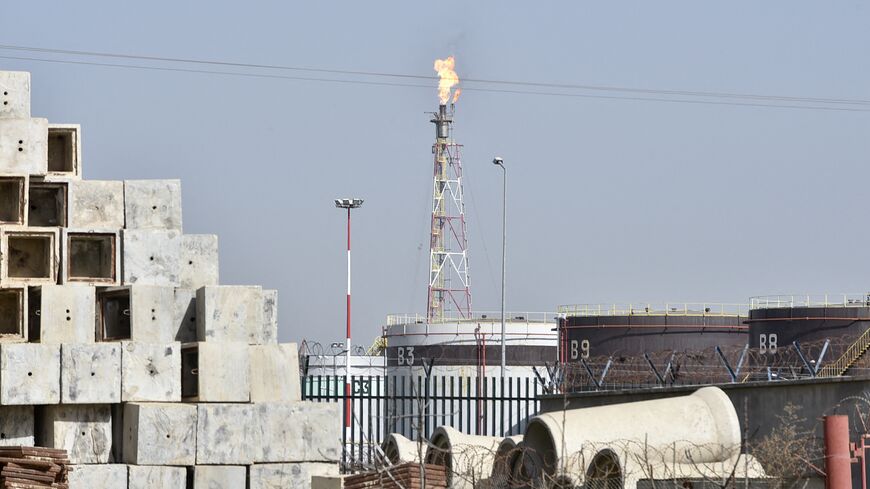 A flare stack burns excess emissions at the Algiers refinery complex in the Algerian capital's southeastern suburb of Baraki, on Feb. 24, 2022.