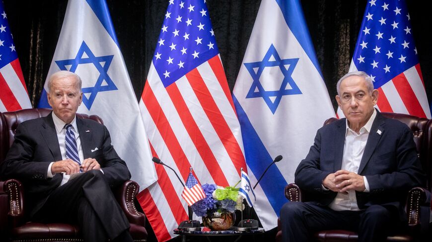 US President Joe Biden (L) sits with Israeli Prime Minister Benjamin Netanyahu, at the start of the Israeli war cabinet meeting, in Tel Aviv on Oct. 18, 2023.