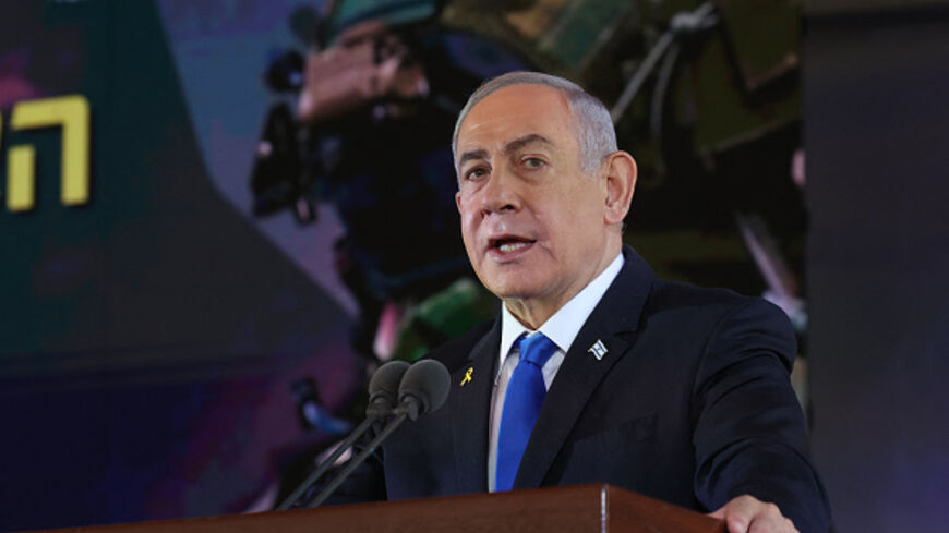 Israel's Prime Minister Benjamin Netanyahu delivers a speech during a ceremony marking the Hebrew calendar anniversary of the Hamas attack on October 7 last year that sparked the ongoing war in Gaza, at the Mount Herzl military cemetery in Jerusalem on October 27, 2024. (Photo by GIL COHEN-MAGEN / POOL / AFP) (Photo by GIL COHEN-MAGEN/POOL/AFP via Getty Images)