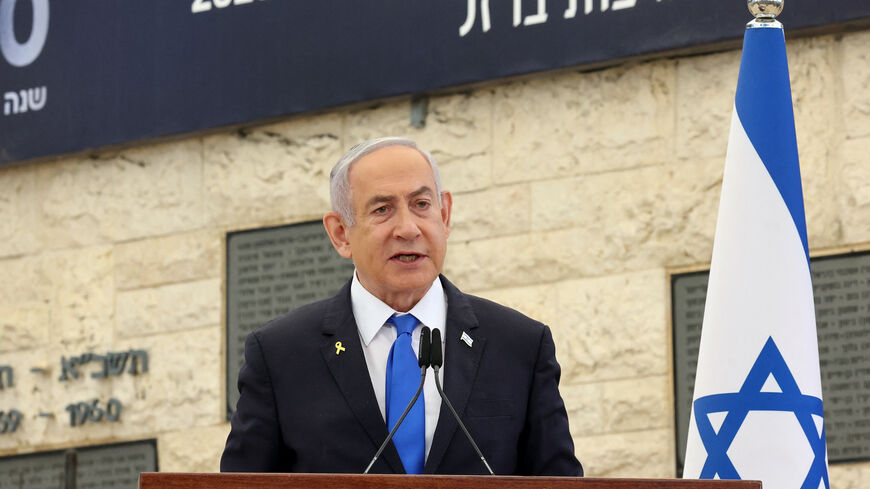 Israeli Prime Minister Benjamin Netanyahu speaks during a memorial ceremony for Israelis killed on the Hebrew calendar anniversary of the Hamas attack on October 7 last year that sparked the ongoing war in Gaza, at the Mount Herzl military cemetery in Jerusalem on Oct. 27, 2024. 