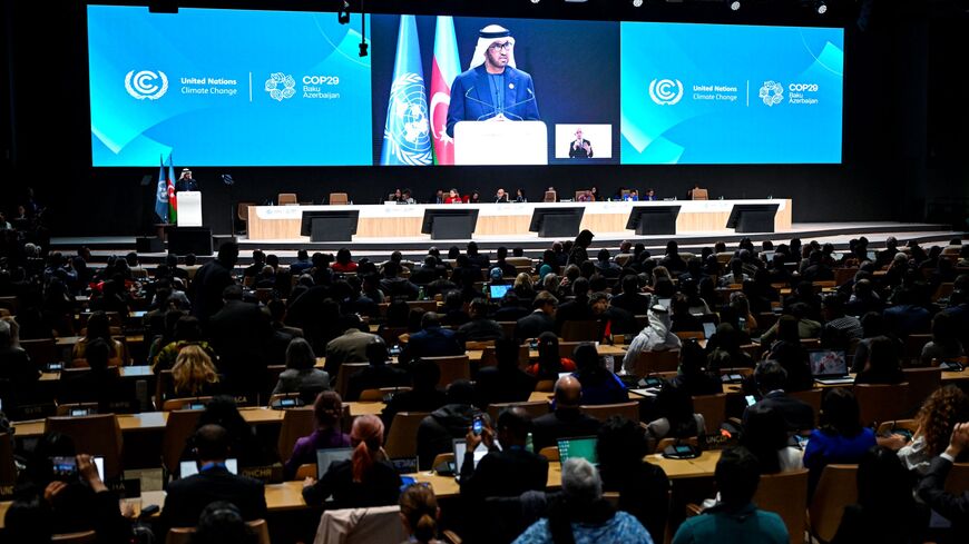 UAE Minister of Industry and Advanced Technology and COP28 President Sultan Ahmed Al Jaber delivers a speech during the opening of the 2024 United Nations Climate Change Conference (COP29) in Baku on November 11, 2024.