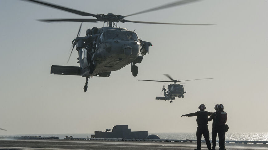 This US Navy photo released Jan. 15, 2015 shows an MH-60S Sea Hawk helicopter from the Red Lions of Helicopter Sea Combat Squadron (HSC) 15 as it prepares to land on the flight deck of the Nimitz-class aircraft carrier USS Carl Vinson (CVN 70) on Jan. 13, 2015 in the Gulf. 