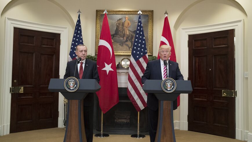 US President Donald Trump (R) and Turkish President Recep Tayyip Erdogan (L) deliver joint statements in the Roosevelt Room of the White House, Washington, DC, May 16, 2017.