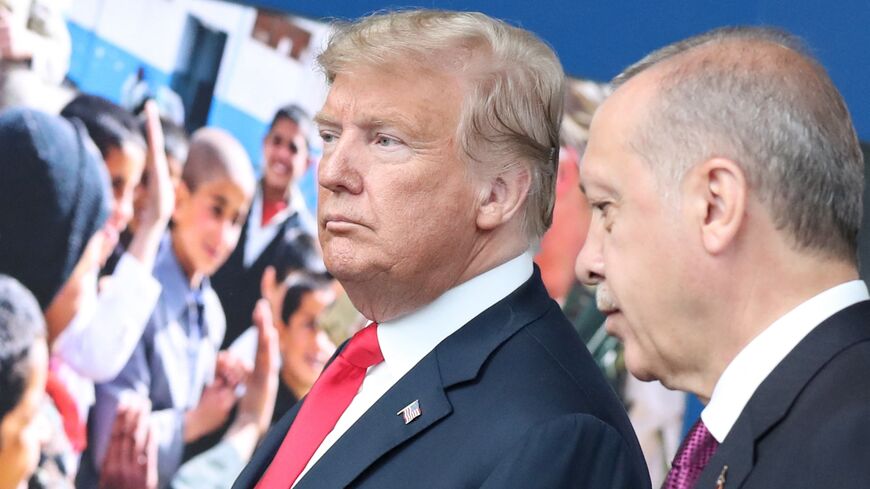 US President Donald Trump (L) talks with Turkish President Recep Tayyip Erdogan (R) at NATO headquarters in Brussels during a NATO summit, July 11, 2018.