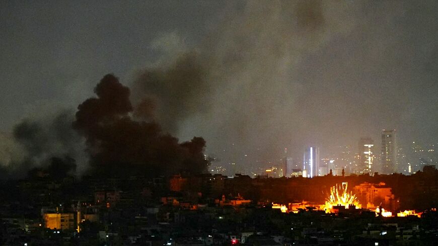 Smoke rises and a fireball erupts from the site of Israeli air strikes that targeted Beirut's southern suburbs