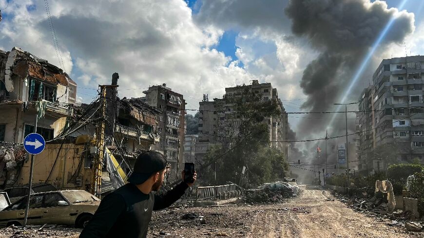 Smoke rises over south Beirut after an Israeli air strike.