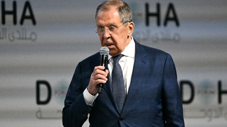 Russian Foreign Minister Sergei Lavrov addresses the Doha Forum, where he held talks on the lightning rebel advance through Syria that has left the forces of Moscow ally President Bashar al-Assad in disarray.