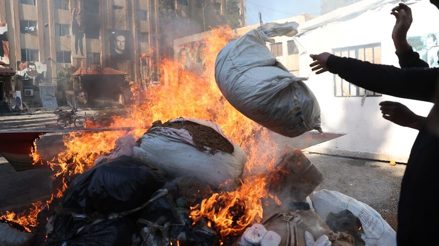 Syria's new authorities burn a cache of drugs at a facility formerly belonging to the security forces of the former government