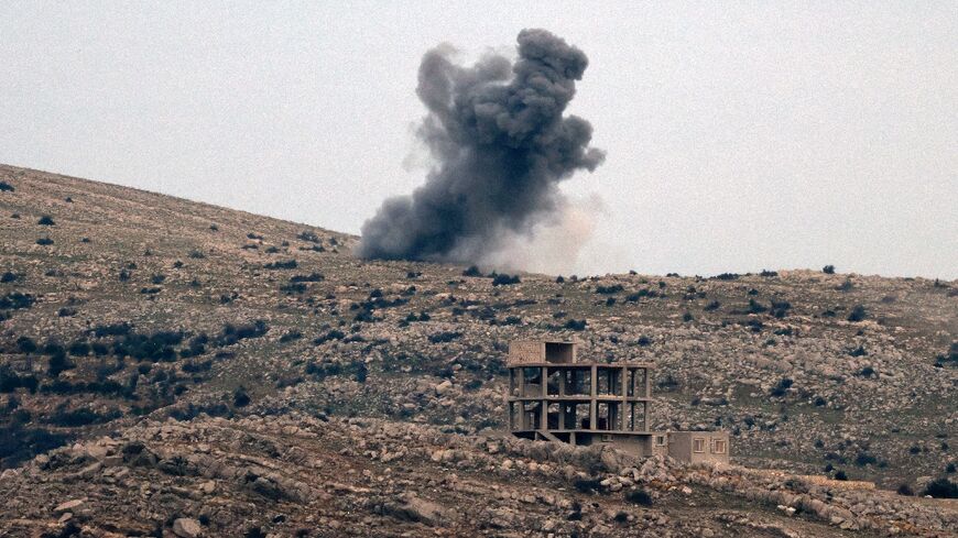 This picture taken from the Israel-controlled part of the Golan Heights shows smoke rising over the outskirts of the Syrian village of Hader during Israeli bombardment of "armed individuals" attacking a UN post