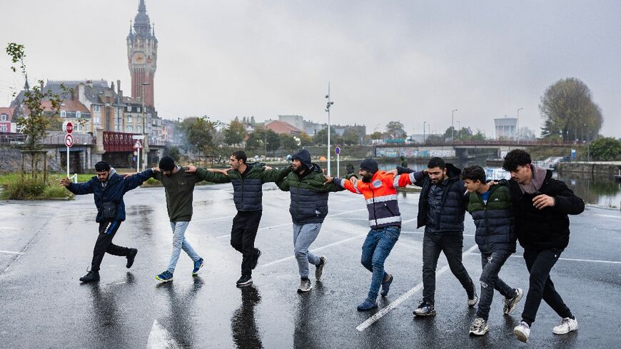 Syrian migrants dance the traditional Dabke in Calais in October