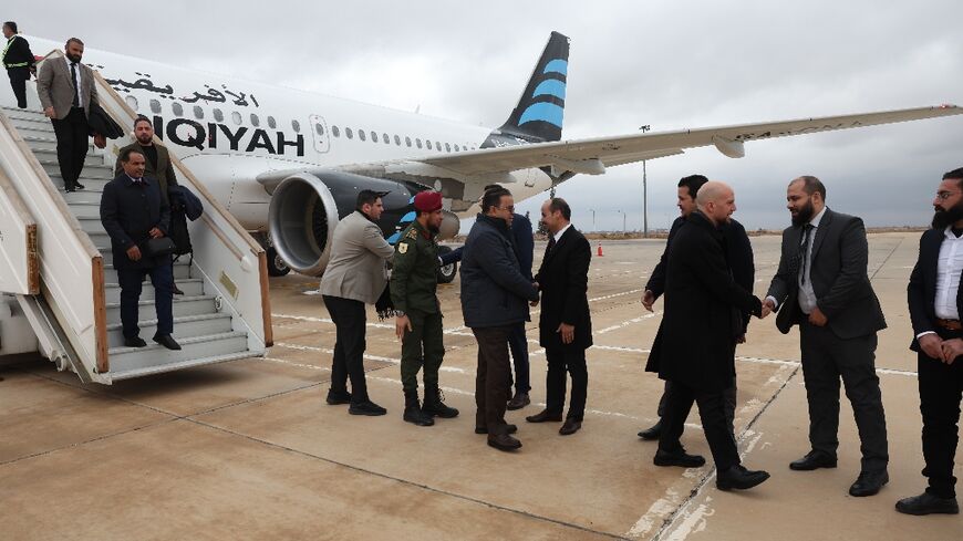 Representatives of Syria's new administration welcome the Libyan delegation to Damascus