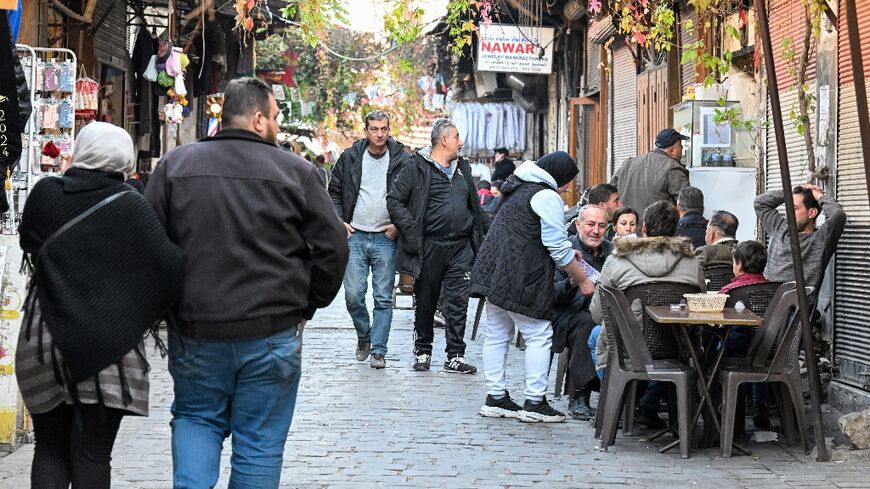 Syrians chat at a cafe in the historic Old City of Damascus.