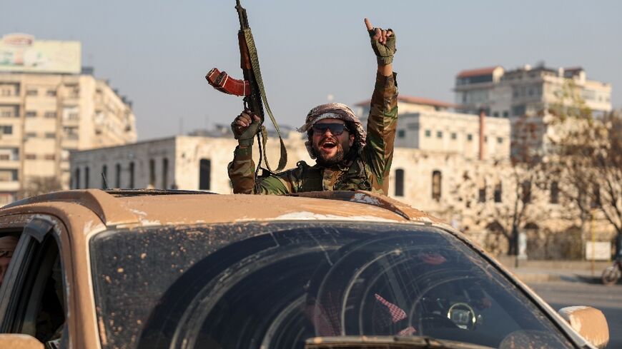 An anti-government fighter in Hama after rebels captured the central Syrian city during their advance on the capital