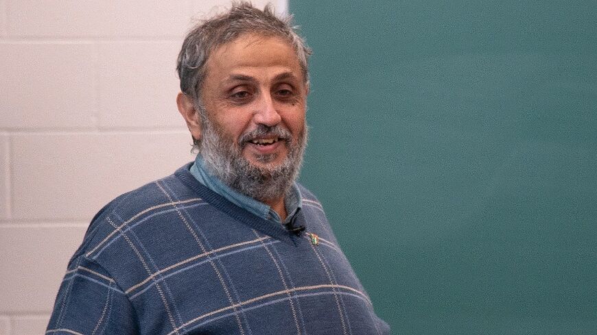 Palestinian professor Ahmed Abu Shaban, here giving a lecture at York University in Toronto, still tries to deliver remote learning to students stuck in Gaza