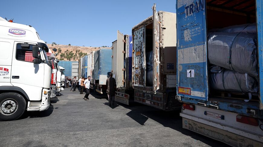 A convoy carrying humanitarian aid arrives in Syria after crossing the Bab al-Hawa border crossing with Turkey, on Sept. 19, 2023. 