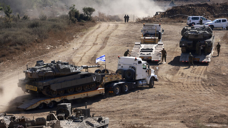 An Israeli tank is transported to a position in the Upper Galilee region of northern Israel near the border with Lebanon, Sept. 29, 2024.