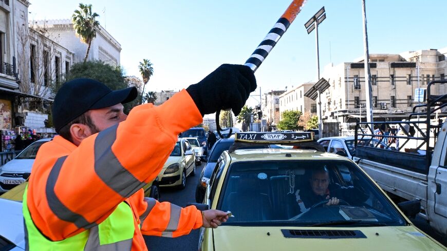 The volunteer traffic officers wear orange vests labelled 'Police'