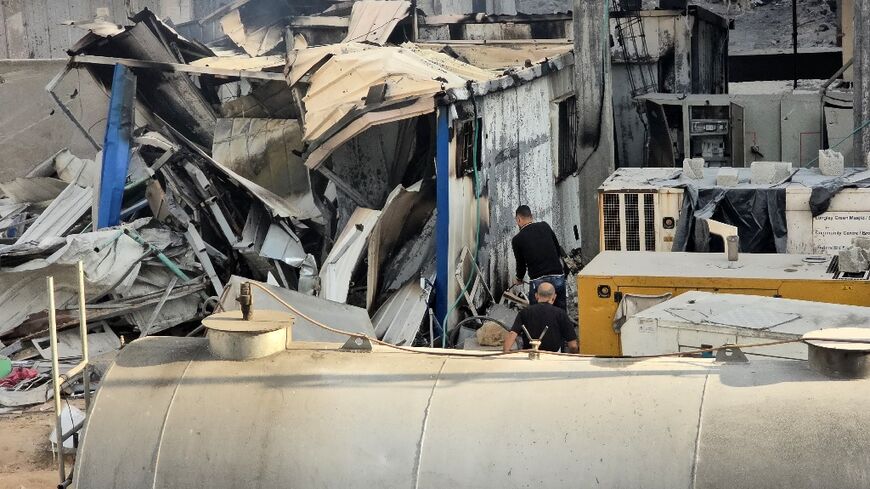 People check the damage outside the Kamal Adwan hospital in north Gaza's Beit Lahia following a reported Israeli raid