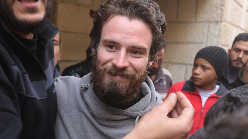 Travis Timmerman, a US citizen who had entered Syria from Lebanon on a Christian pilgrimage and had been detained for several months, speaks with reporters in a house in Damascus