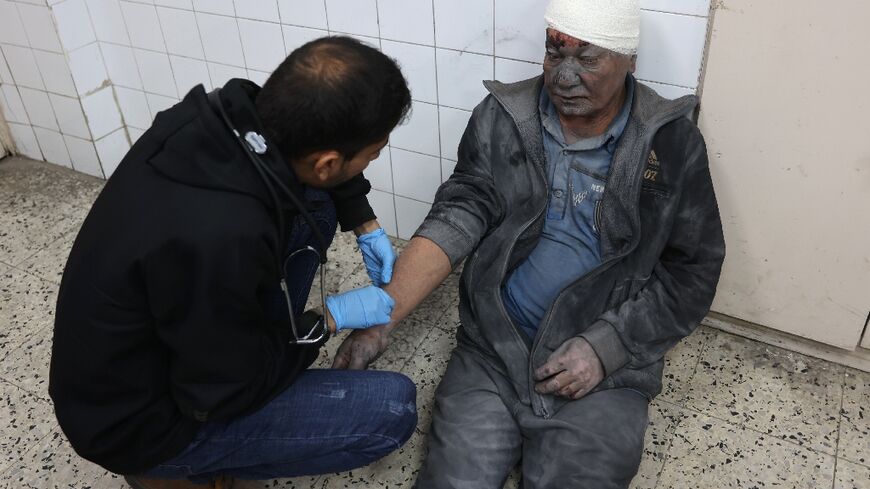 A wounded Palestinian man receives treatment at Al-Ahli Arab hospital in Gaza City, where the Civil Defence agency said an Israeli air strike killed four people