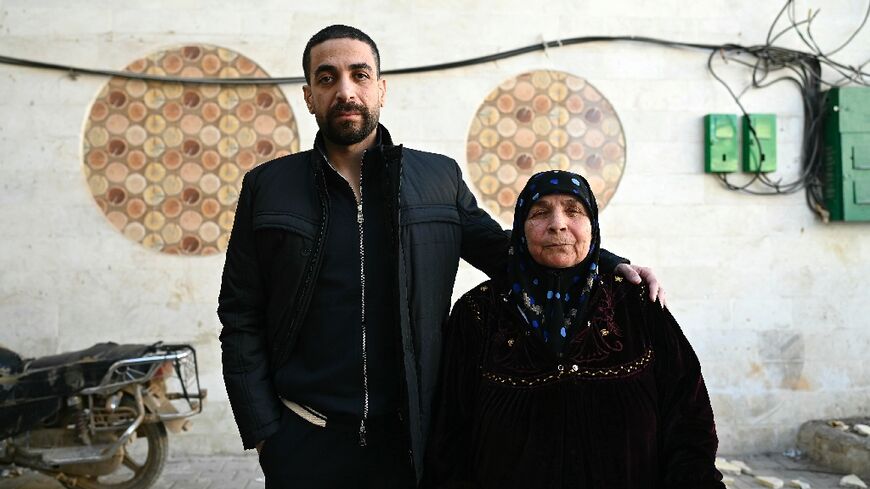 Freed Syrian prisoner Ghazi Mohammed al-Mohammed, 39, with his mother Fatima Abd al-Ghany -- 'It's like he's not my son' anymore, she says