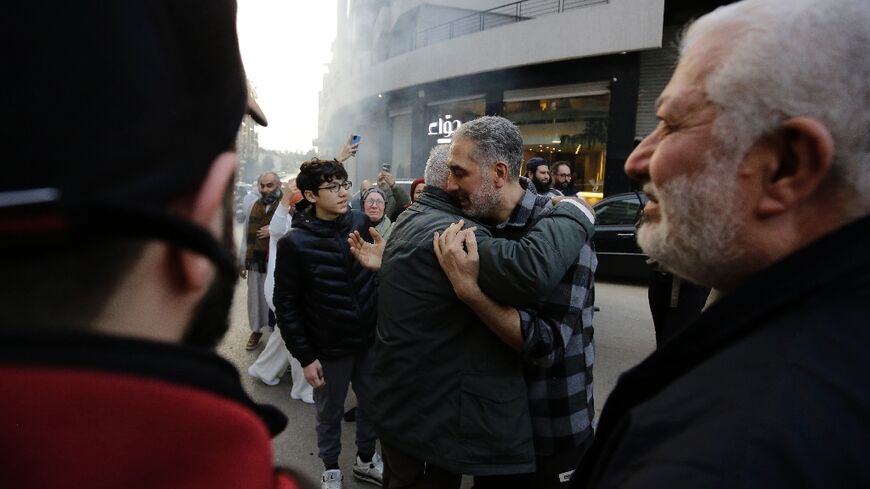 Moaz Merheb, 51, is received by his family and friends after 18 years of imprisonment in Syria's notorious Saydnaya prison