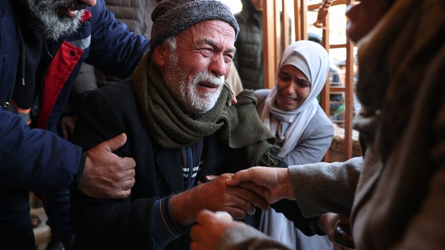 Grief-stricken relatives gather outside the Nasser Hospital in Khan Yunis following the latest Israeli air strikes on southern Gaza.