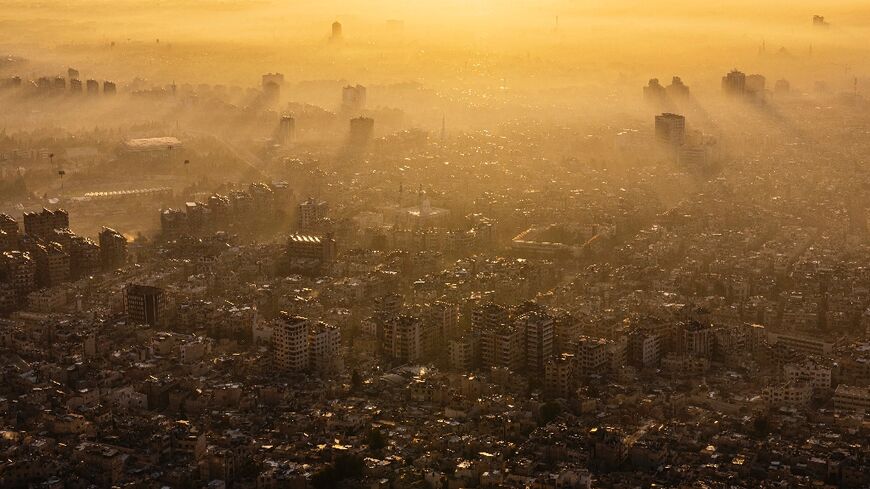 Damascus is seen at sunrise from Mount Qasyun, which for years was off limits to regular people