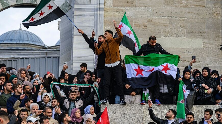 Syrians in Istanbul celebrate the reported fall of the Assad regime